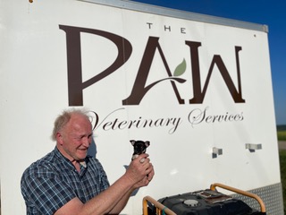 Dr. Frank holding a puppy